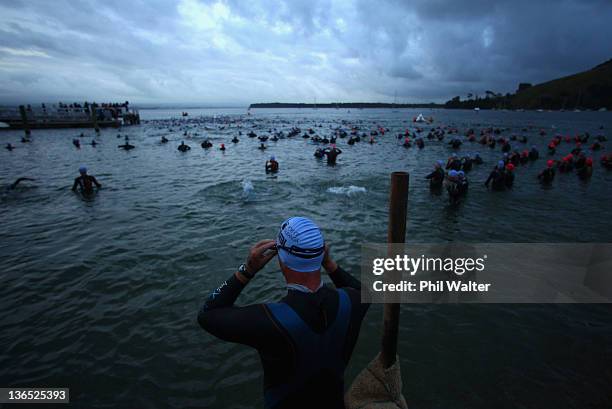 Competitors enter the water for the start of the 2012 Port of Tauranga Half Ironman on January 7, 2012 in Tauranga, New Zealand.