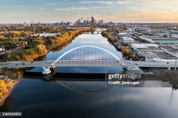 aerial view of minneapolis and the lowry avenue bridge - minneapolis drone stock pictures, royalty-free photos & images