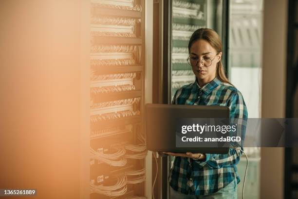 woman in data center - cloud cable stock pictures, royalty-free photos & images