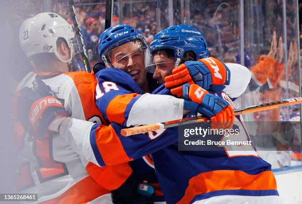 Anthony Beauvillier of the New York Islanders celebrates a second period goal by Brock Nelson of the New York Islanders against the Philadelphia...