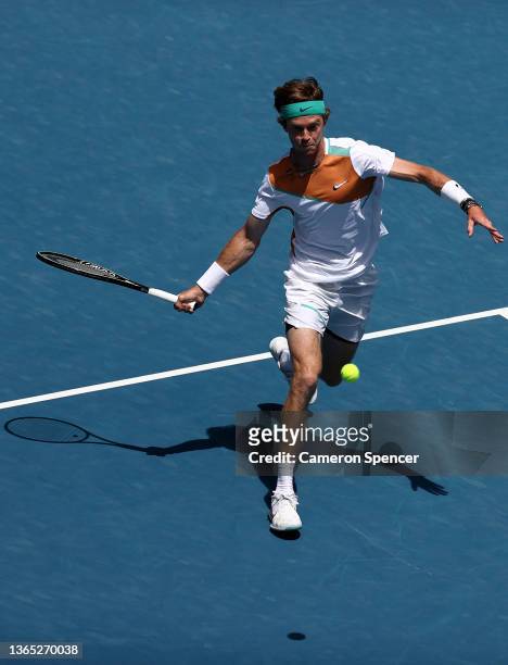 Andrey Rublev of Russia plays a forehand in his first round singles match against Gianluca Mager of Italy during day two of the 2022 Australian Open...