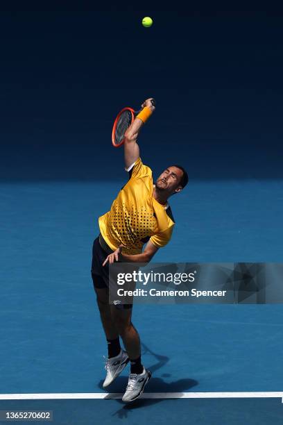 Gianluca Mager of Italy serves in his first round singles match against Andrey Rublev of Russia during day two of the 2022 Australian Open at...