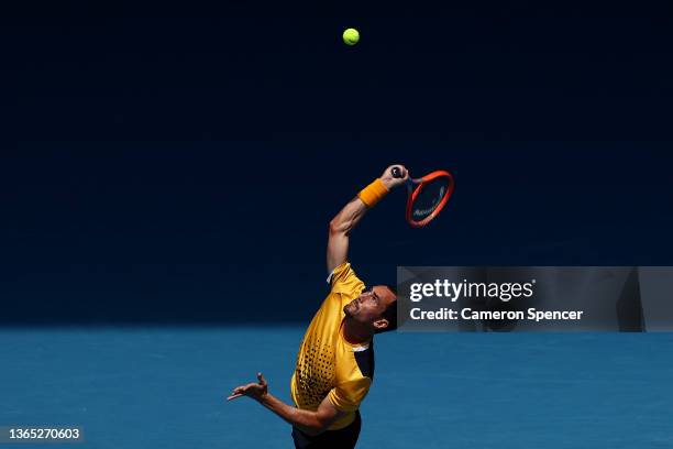 Gianluca Mager of Italy serves in his first round singles match against Andrey Rublev of Russia during day two of the 2022 Australian Open at...