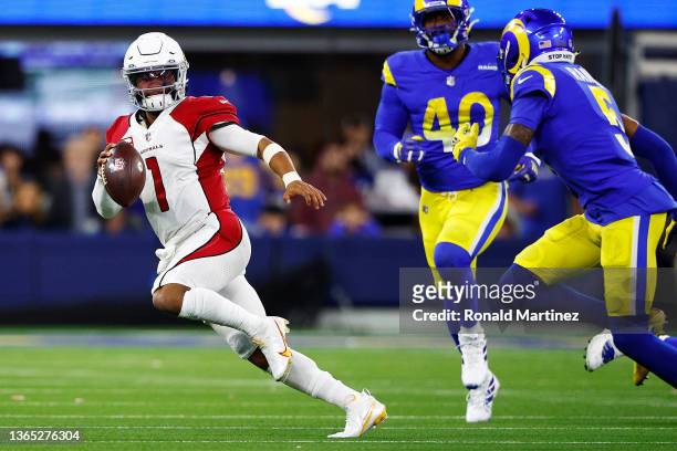 Kyler Murray of the Arizona Cardinals scrambles against the Los Angeles Rams during the third quarter in the NFC Wild Card Playoff game at SoFi...