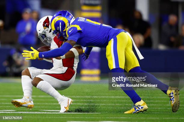 Jalen Ramsey of the Los Angeles Rams tackles Kyler Murray of the Arizona Cardinals during the third quarter in the NFC Wild Card Playoff game at SoFi...