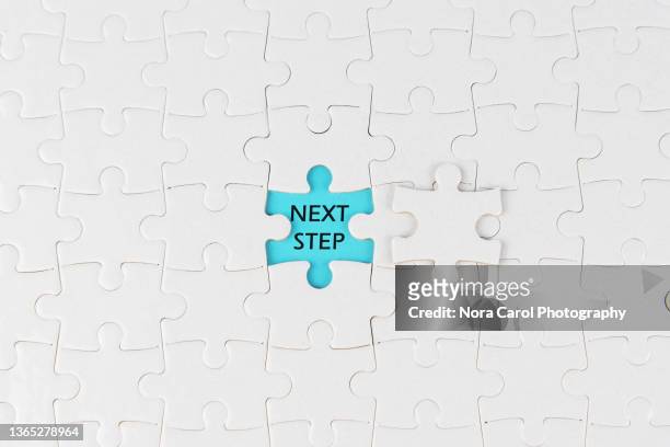 next step text on jigsaw puzzle - waiting concept stock pictures, royalty-free photos & images