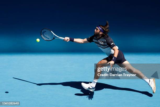 Nikoloz Basilashvili of Georgia plays a forehand in his first round singles match against Andy Murray of Great Britain during day two of the 2022...