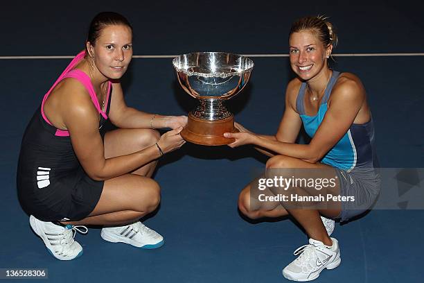 Lucie Hradecka and Andrea Hlavackova of the Czech Republic hold the trophy up after beating Flavia Pennetta of Italy and Julia Goerges of Germany in...