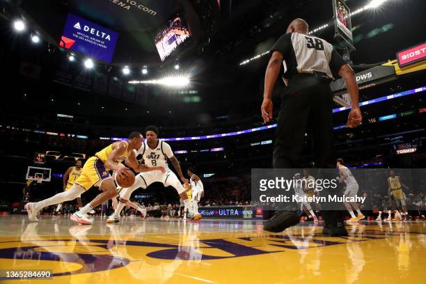 Avery Bradley of the Los Angeles Lakers drives to the basket against Rudy Gay of the Utah Jazz during the first quarter at Crypto.com Arena on...