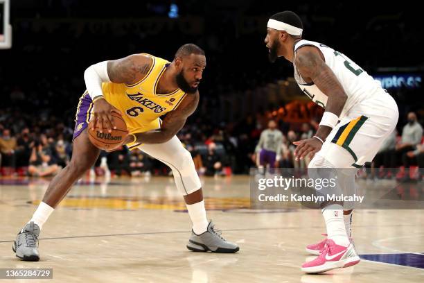 LeBron James of the Los Angeles Lakers handles the ball against Royce O'Neale of the Utah Jazz during the second quarter at Crypto.com Arena on...