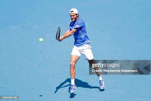 Joao Sousa of Portugal plays a backhand in his first round singles match against Jannik Sinner of Italy during day two of the 2022 Australian Open at...