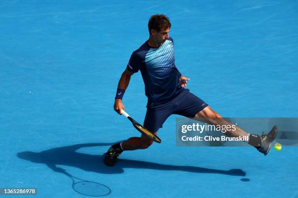 Henri Laaksonen of Switzerland reacts in his first round singles match against Daniil Medvedev of Russia during day two of the 2022 Australian Open...