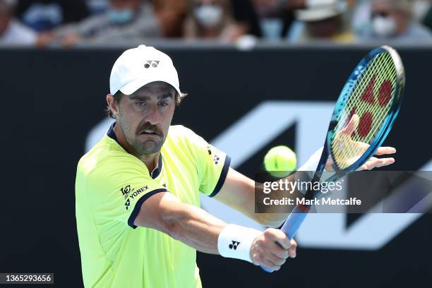 Steve Johnson of United States plays a backhand in his first round singles match against Jordan Thompson of Australia during day two of the 2022...