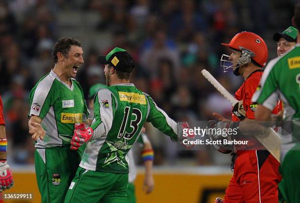 David Hussey of the Stars is congratulated by his team mates after dismissing Brad Hodge of the Renegades during the T20 Big Bash League match...