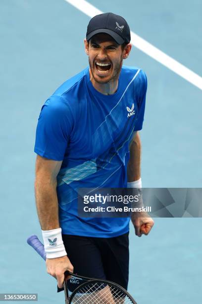 Andy Murray of Great Britain reacts in his first round singles match against Nikoloz Basilashvili of Georgia during day two of the 2022 Australian...