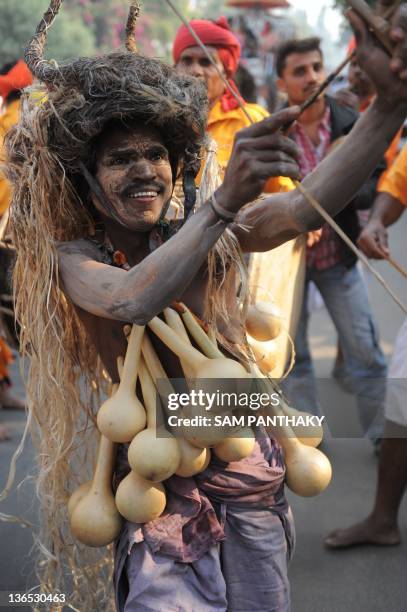Tribal dancer from the Chotta Udepur region of Gujarat state participates in Rath Yatra, a procession in memory of late Acharya Ramchandra...