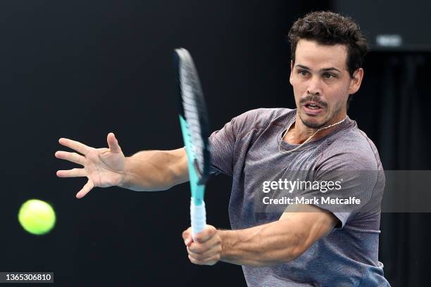 Alex Bolt of Australia plays a forehand in his first round singles match against Alejandro Davidovich Fokina of Spain during day two of the 2022...