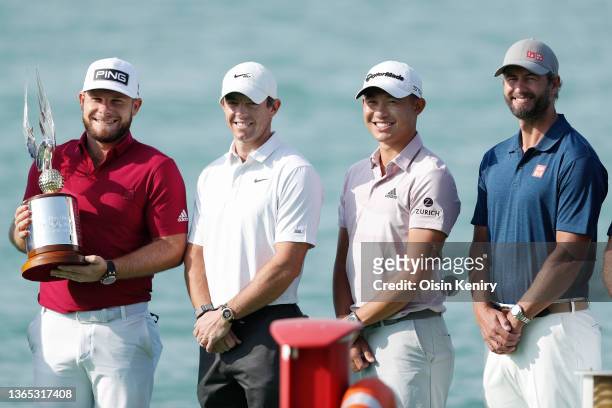 Tyrrell Hatton of England, Rory McIlroy of Northern Ireland, Collin Morikawa of the USA and Adam Scott of Australia pose for a photo prior to the Abu...