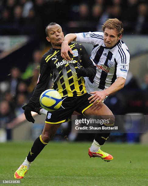 Robert Earnshaw of Cardiff City is challenged by Craig Dawson of West Bromwich Albion during the FA Cup Third Round match between West Bromwich...