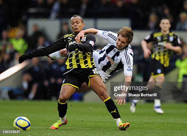 Robert Earnshaw of Cardiff City is challenged by Craig Dawson of West Bromwich Albion during the FA Cup Third Round match between West Bromwich...