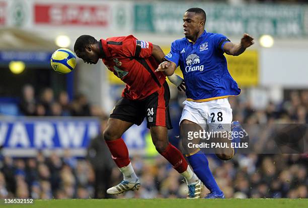 Everton's Nigerian striker Victor Anchebe vies with Tamworth's Congolese defender Patrick Kanyuka during the English FA Cup 3rd Round football match...