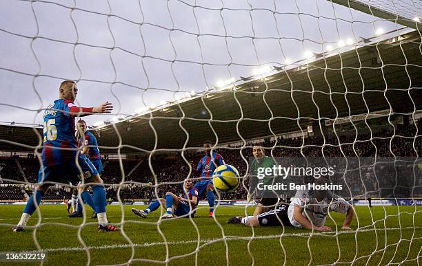 Players look on as the ball crosses the line from Theo Robinson's shot during the FA Cup sponsored by Budweiser Third Round match between Derby...