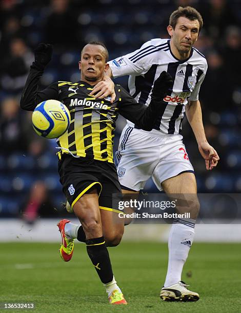 Robert Earnshaw of Cardiff City is challenged by Gareth McAuley of West Bromwich Albion during the FA Cup Third Round match between West Bromwich...