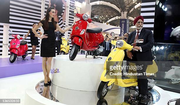 Ravi Chopra, Chairman and Managing Director of Piaggio India, unveils the 125 cc Vespa scooters during the 11th Auto Expo 2012 at Pragati Maidan on...