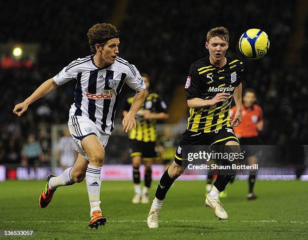 Billy Jones of West Bromwich Albion and Joe Mason of Cardiff City challenge for the ball during the FA Cup Third Round match between West Bromwich...
