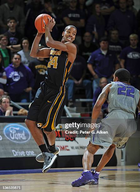 Guard Kim English of the Missouri Tigers looks to make a pass against guard Rodney McGruder of the Kansas State Wildcats during the second half on...