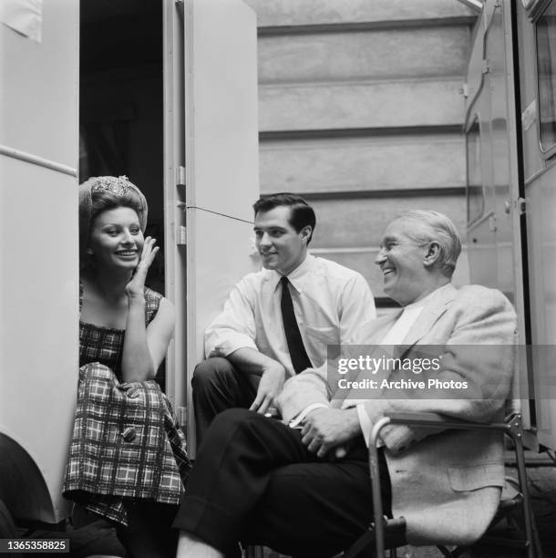 From left to right, actors Sophia Loren, John Gavin and Maurice Chevalier on the set of the film 'A Breath of Scandal', 1959.