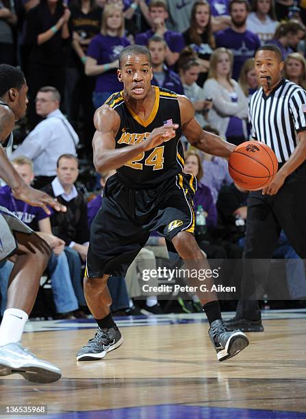 Guard Kim English of the Missouri Tigers brings the ball up court against the Kansas State Wildcats during the first half on January 7, 2012 at...