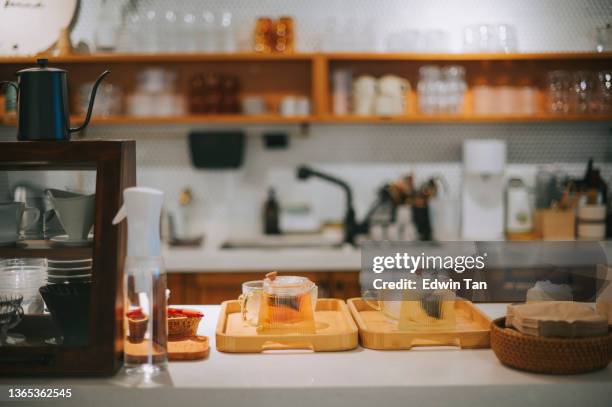 interior of cozy café coffee shop small business with tea pot at counter artisanal food and drink establishment - bar drink establishment stock pictures, royalty-free photos & images
