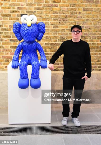 Artist and designer KAWS at the "New Fiction" Exhibition showcasing his paintings and sculptures at Serpentine North on January 18, 2022 in London,...