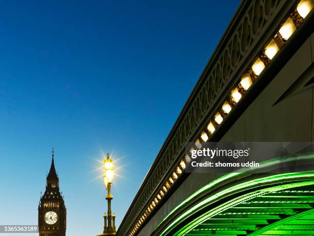 london big ben illuminated at dusk - bridge architecture up close night stock pictures, royalty-free photos & images