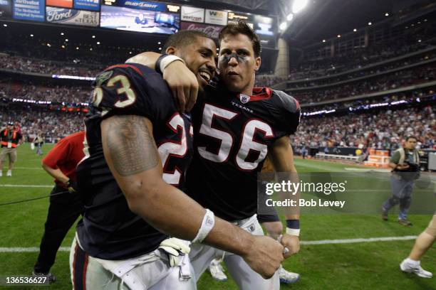 Arian Foster and Brian Cushing of the Houston Texans celebrate as they walk off of the field after they woon 31-10 against the Cincinnati Bengals...