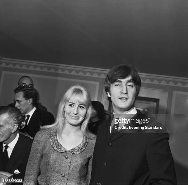 English musician John Lennon of the Beatles with his wife Cynthia at the launch of his book 'In His Own Write' at the Dorchester Hotel in London, UK,...