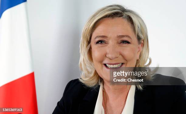 France's far-right party Rassemblement National candidate for the 2022 French presidential election Marine Le Pen speaks to medias during a press...