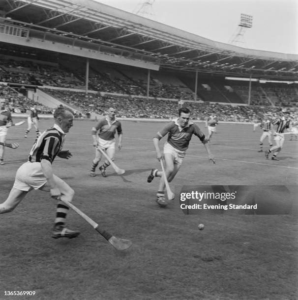 Tipperary versus Kilkenny in an Irish hurling match at Wembley Stadium in London, UK, 16th May 1964.