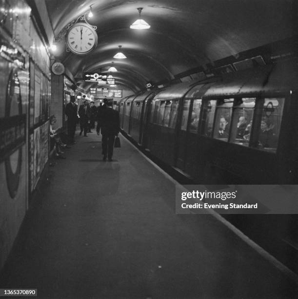 The Piccadilly Line platform at Leicester Square underground station in London, UK, after a 'wages snatch', 14th May 1964. Employees' wages were...