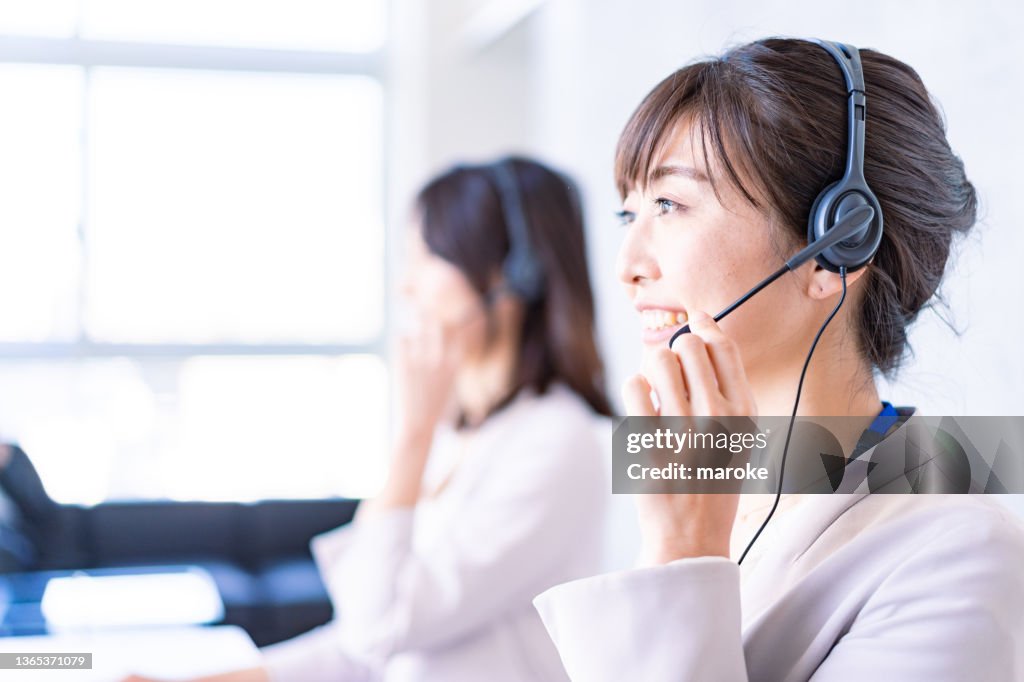 Operator answering the phone with a smile