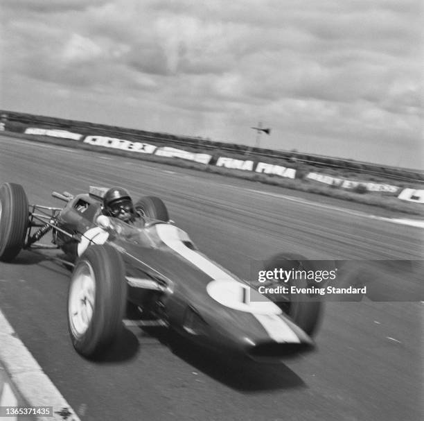 Scottish racing driver Jim Clark in a Team Lotus Lotus-Climax during the 16th BRDC International Trophy race at Silverstone, UK, 2nd May 1964.