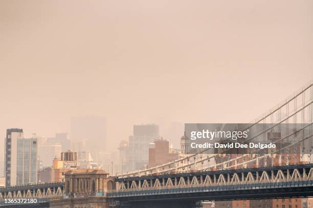 Smoke from wildfires in Canada shrouds lower Manhattan on June 30, 2023 in New York City. The eastern U.S. Is once again experiencing air quality...