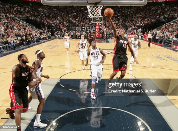 Mario Chalmers of the Miami Heat goes to the basket during the first half against the New Jersey Nets on January 7, 2012 at the Prudential Center in...