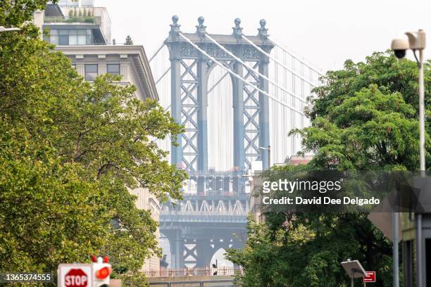 Smoke from wildfires in Canada shrouds the Manhattan bridge on June 30, 2023 in New York City. The eastern U.S. Is once again experiencing air...