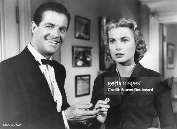 American actor Robert Cummings and american actress Grace Kelly on the set of the movie Dial M for Murder directed and produced by British Alfred...