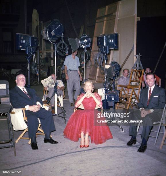 British director and producer Alfred Hitchcock, american actress Grace Kelly and american actor Robert Cummings on the set of the movie Dial M for...