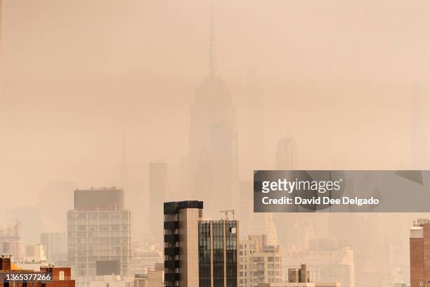 Smoke from wildfires in Canada shrouds the Empire State Building on June 30, 2023 in New York City. The eastern U.S. Is once again experiencing air...