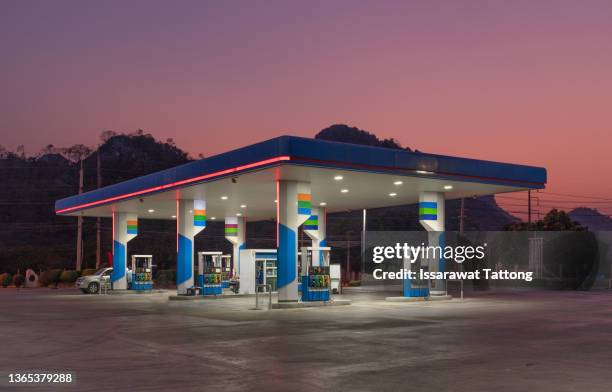 gas station at sunset. - bensinstation bildbanksfoton och bilder