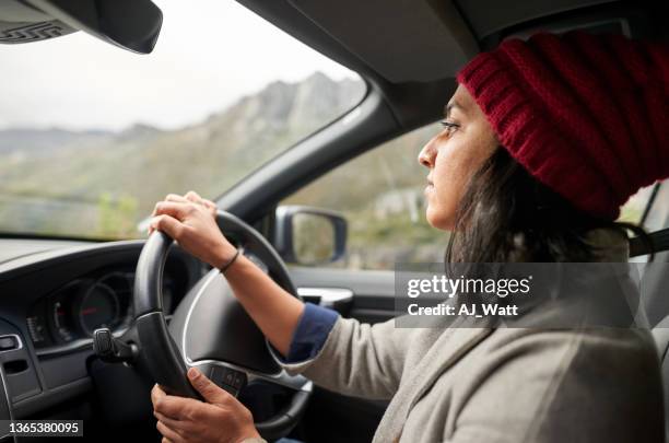 woman going for a drive in her car on a winter day - female driving stock pictures, royalty-free photos & images